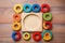 Top view of kids toys frame on wooden background with copy space.