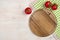 Top view of kitchen cutting board over wooden background