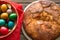 Top view of a Kozunak Traditional Easter sweet bulgarian bread and colored eggs