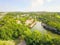 Top view lake house with boat storage green trees in Austin, Tex