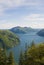 A top view of Lake Lugano, Switzerland from the height of Mount Monte Bre. Beautiful mountain scenery on a sunny summer day.