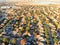 Top view lakeside residential subdivision houses with colorful autumn leaves near Dallas, Texas