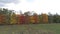 Top view of the landscape of central Russia with trees that are covered with autumn foliage.