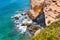Top view of landscape view of rocks, cliff, sea waves in Algarve, Lagos, Portugal. seagull sitting on a cliff in Atlantic ocean