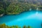 Top view of a large blue lake in Plitvice lakes national Park, Croatia. Beautiful landscape: clean blue water, forest, waterfalls