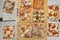 Top view of large quantity of square pieces of pizza of different flavors