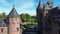 Top view of the largest castle in the Netherlands, De Haar. A beautiful quadcopter flight over the castle, the park and the water