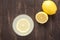 Top view lemonade with fresh lemon on wooden background