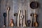 Top view lot of wooden spoons made of precious wood on wooden table, eco-friendly concept of cutlery, handmade tableware