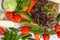 Top view of lots of vegetables on wooden table