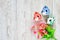 Top view lovely small decor easter house in pink -red ,blue ,green pastel and bouquet spring flower on wooden background. Easter