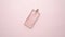 Top view of luxury bottle of perfume on pastel pink surface. Minimal composition. Flat lay