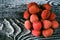 Top view lychee fruit on wooden background
