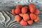 Top view lychee fruit on wooden background