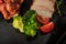 top view macro broccoli and tomatoes with smoked meat