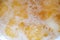 Top view Macro Close up motion of background surface detail view of hot golden shining yellow olive oil boiling deep frying and cr