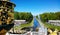 Top view of the main group of bright fountains in Peterhof, a piece of decorative green beautiful vases in the foreground