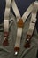 Top view of male accessories, suspenders or braces. Vertical image