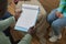 Top view of male psychologist holding blank clipboard