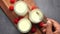 Top view of man hand eating fresh yogurt in a jar