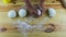 Top view on man hands by knife cut in half big ball of yeast dough on wooden table