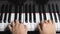 Top view of a man musician is playing piano and teach student online. Closed up to the piano key