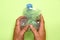 top view of man\'s hands grasping a squeezed plastic bottle. plastic recycling concept. flat lay flat design