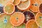 Top view of many dehydrated citrus fruits as lemons, tangerines, oranges on blue background