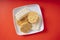 Top view - Many type of instant noodles on white plate over red background