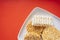 Top view - Many type of instant noodles on white plate over red background