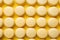 Top view of many yellow lemon French macarons sweets with sugar sprinkles