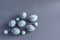 Top view of marble colored Easter eggs on a gray background. Easter background