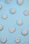 Top view marshmallow texture monocolored mocup, colorful french macaron cookie template. White french zephyr on blue background