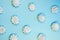 Top view marshmallow texture monocolored mocup, colorful french macaron cookie template. White french zephyr on blue background