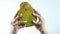 top view of men holding a jackfruit on table