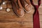 Top view of mens brown casual shoes, tie, wristwatch and glasses