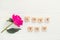 Top view Message I love you spelled in wooden blocks with purple pink peony flower on white wooden table. Love, Valentines day bac