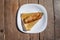 Top view Mexican food dish. fried tamal on wooden table