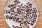 Top view of milk bowl, alphabet letters of cereal and chocolate flakes on wooden table, healthy Breakfast for kids and adults,