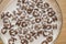 Top view of milk bowl, alphabet letters of cereal and chocolate flakes on wooden table, healthy Breakfast for kids and adults,