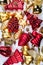A top view of mixed golden and red christmas ornaments on white backgrounds