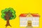 Top view mockup colorful drawing school building with tree on a yellow backgroud with copy space. Flat lay, copy space