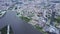 Top view of modern city with river in center. Stock footage. Beautiful modern city with canal in center and lots of
