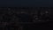 Top view of modern night city with river at night. Stock footage. Beautiful landscape of night city with lights