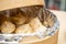 Top view momo or dumplings served in a bamboo steamer placed on a wooden surface