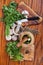 Top view of mortars and fresh herbs on wood table