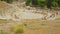 Top view of mosaics on Dionysus Theater stage in Greece, many tourists walking