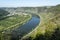 Top view on Mosel river valley and green terraced vineyards, Germany, production of quality white and red wine, riesling