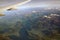 Top view of the mountain peaks of the Alps, covered by clouds and snow in the distance