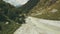 Top view mountain river. Hiking group walking along mountain river